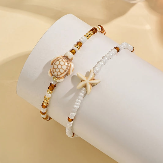 2er-Set bezaubernde maritime Damen Fußkettchen in Weiß und Beige mit Perlen, Seestern und Schildkröte