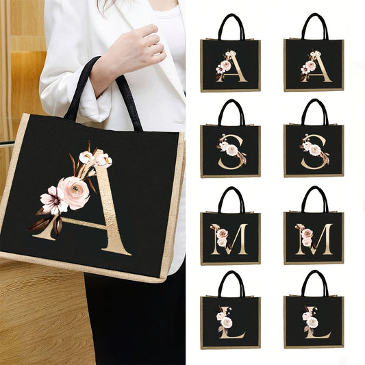 Personalisierte Monogramm-Print-Tragetasche von A bis Z - mit Blume und Buchstabe in Gold auf Schwarz - Schwarze Jute-Tragetasche für viele Anlässe